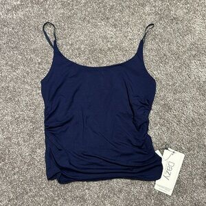 Navy tank top lined with bra. Never worn. Tags still on